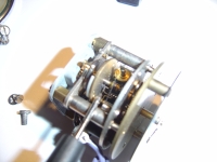  pointer showing carbon dust where the contact hairsping meets the impulse pin on the balance wheel